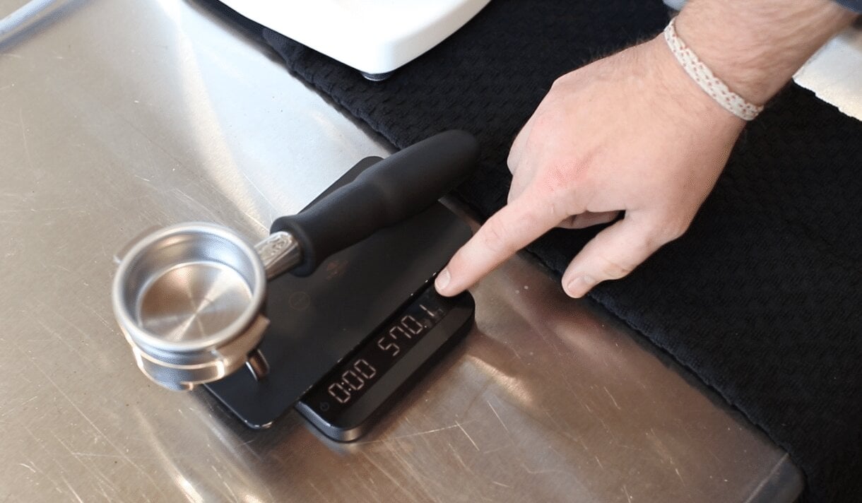 La Marzocco espresso machine portafilter and group head detail with steam wand