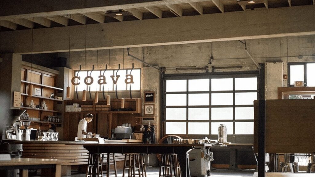 Coava coffee shop interior with espresso bar featuring La Marzocco espresso machine and barista at work