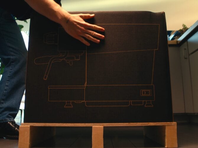 La Marzocco Linea Mini espresso machine in delivery box with floor plan diagram
