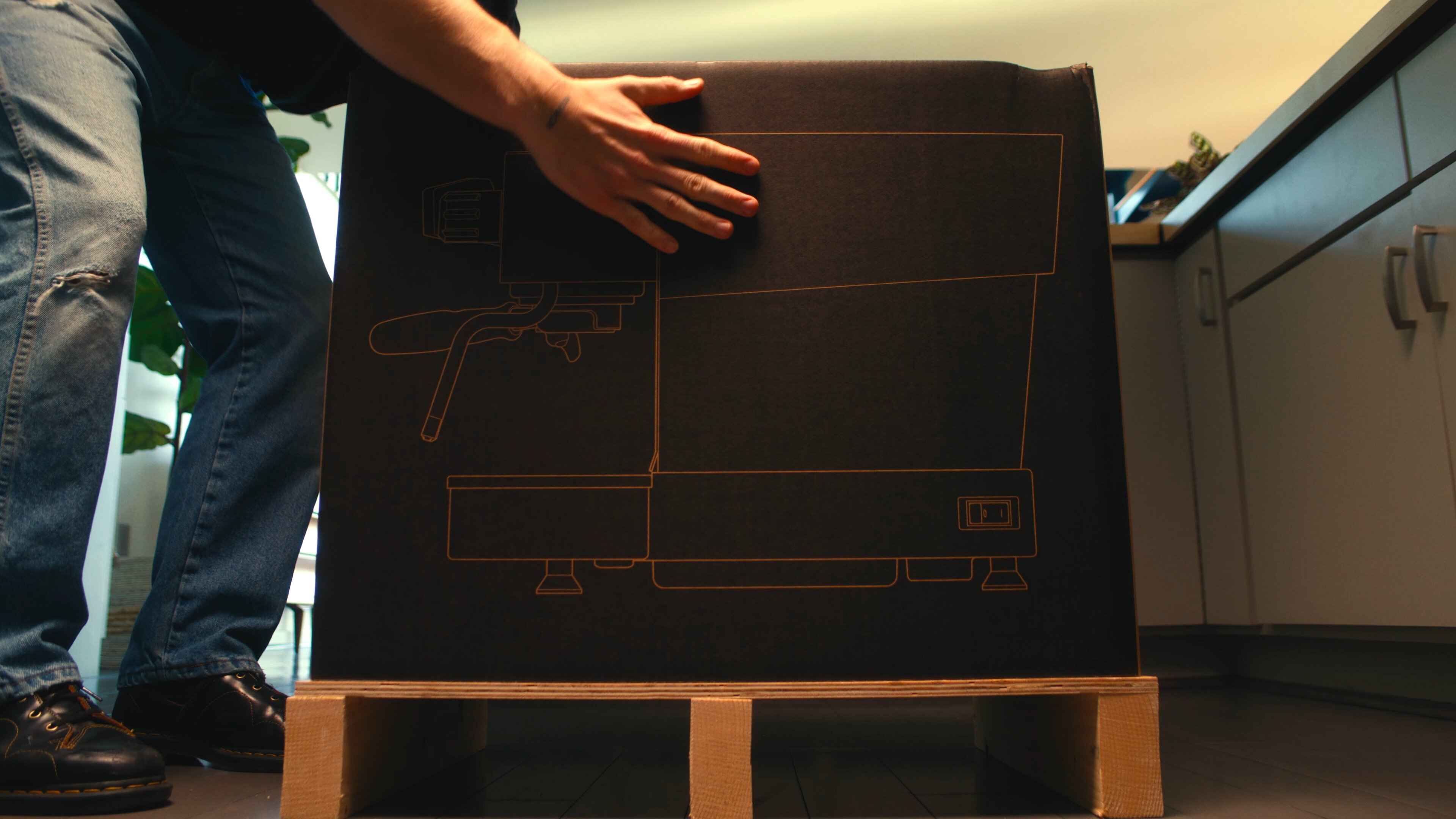 La Marzocco Linea Mini espresso machine in delivery box with floor plan diagram