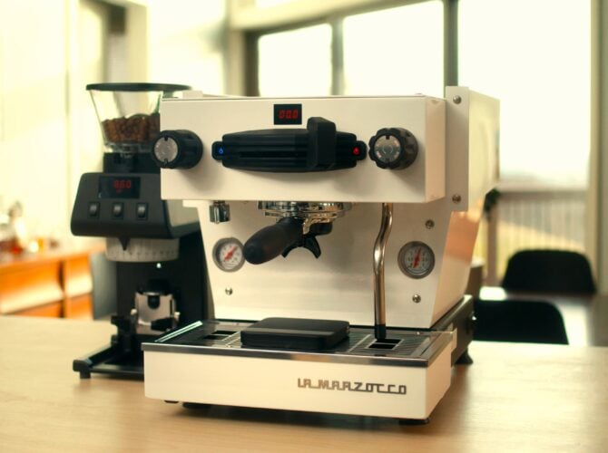 La Marzocco Linea Mini espresso machine with grinder in bright kitchen, front view