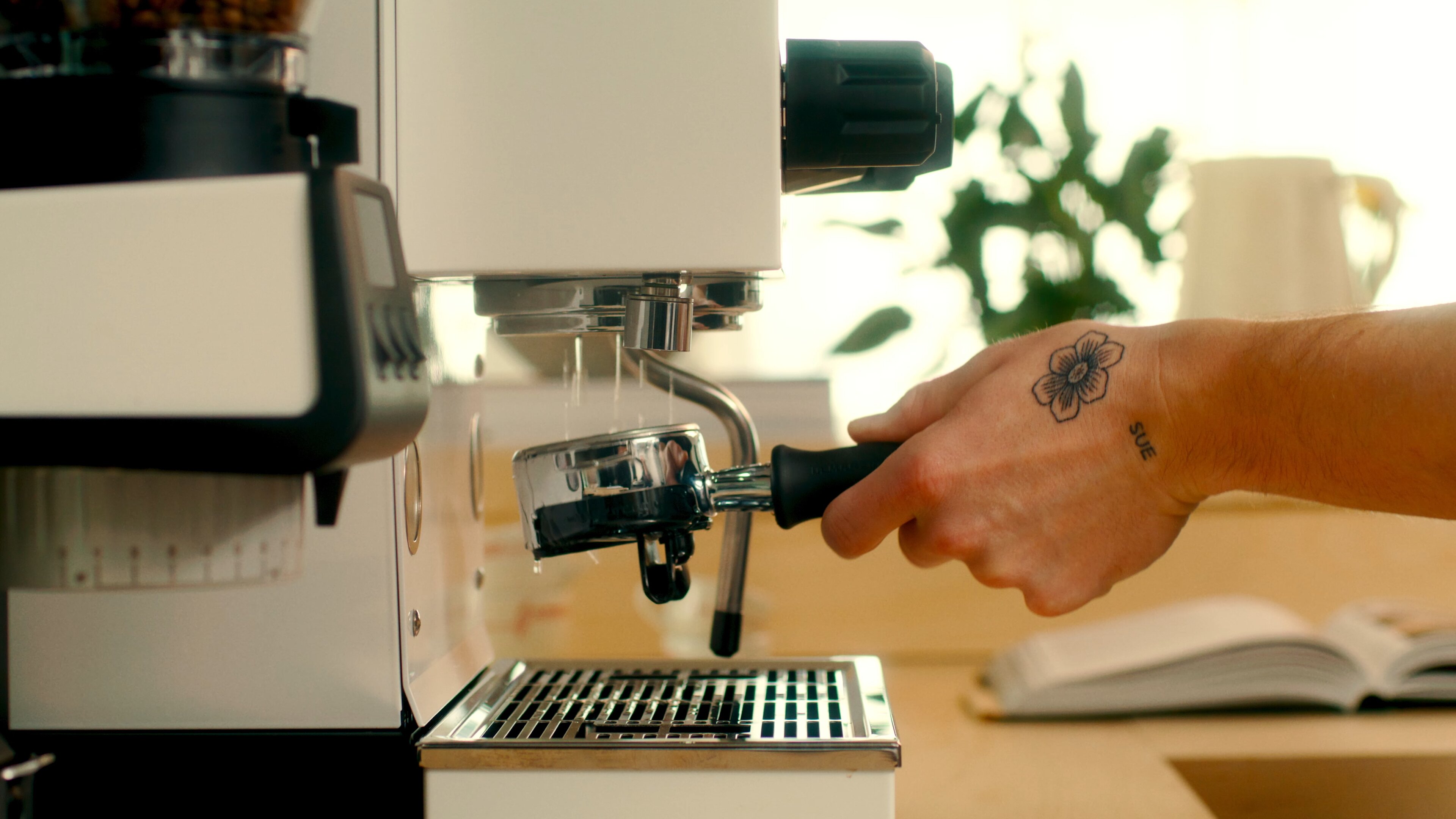 La Marzocco Linea Mini espresso machine, rinsing the group head with water