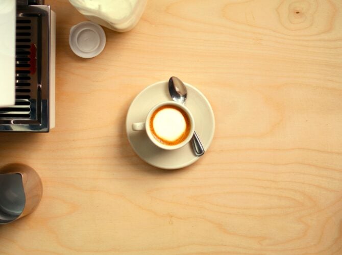 La Marzocco Linea Mini espresso machine with latte art in a home kitchen setting