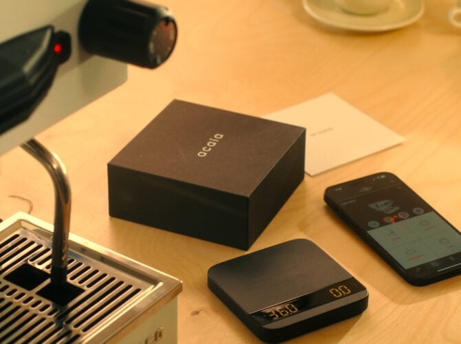 La Marzocco Linea Mini espresso machine with brew-by-weight setup and scale on wooden table