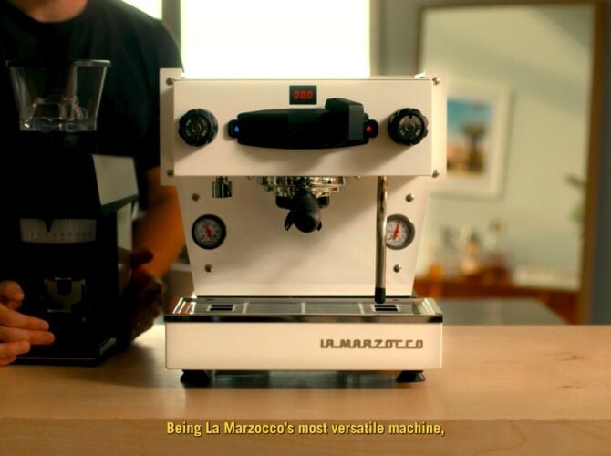 La Marzocco Linea Mini espresso machine in white, three-quarter front view with operator