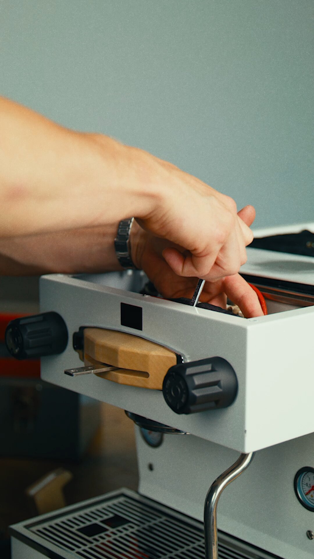 Inserting portafilter into group head on La Marzocco Linea Mini espresso machine
