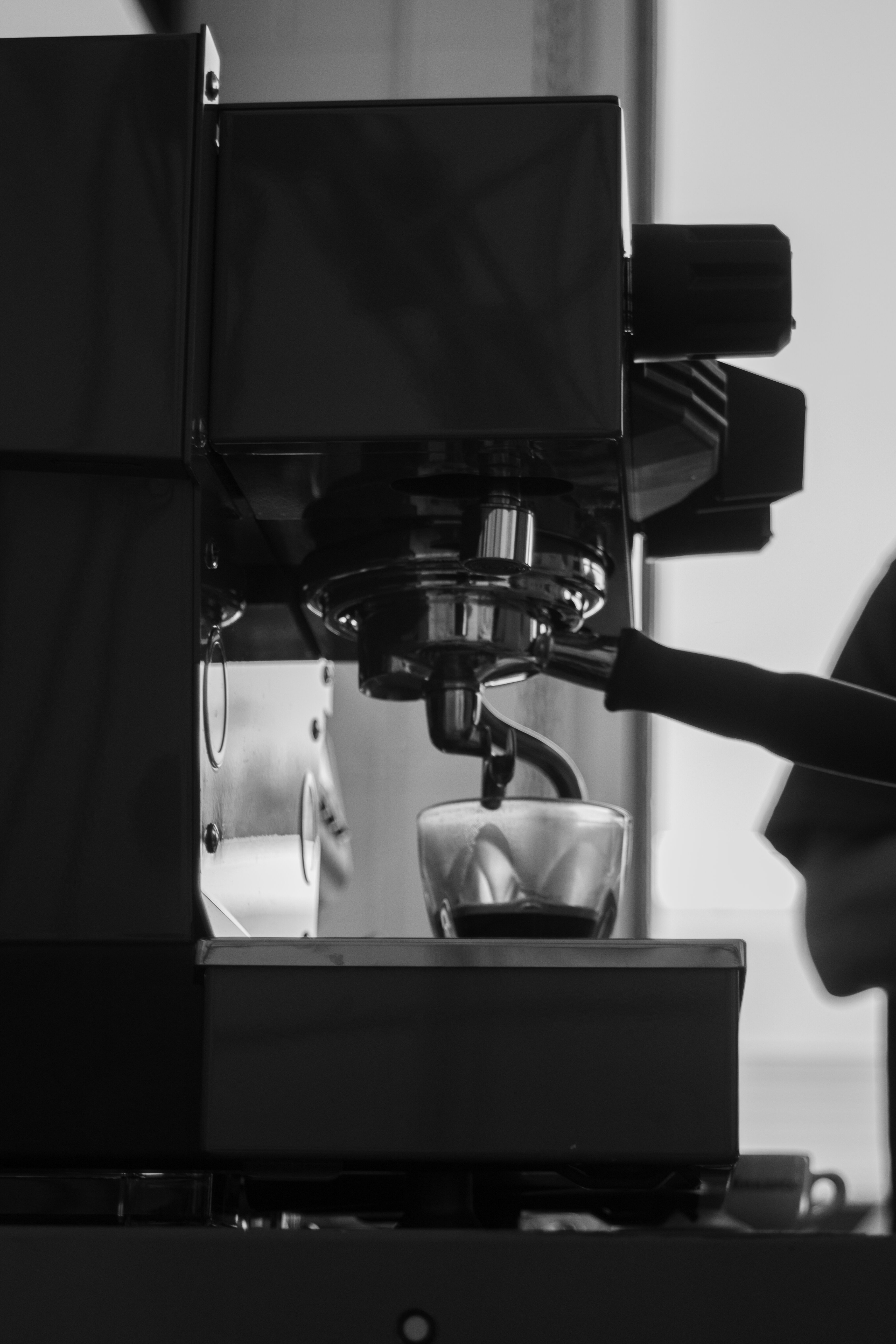 La Marzocco Linea Mini espresso machine brewing espresso, black and white detail view