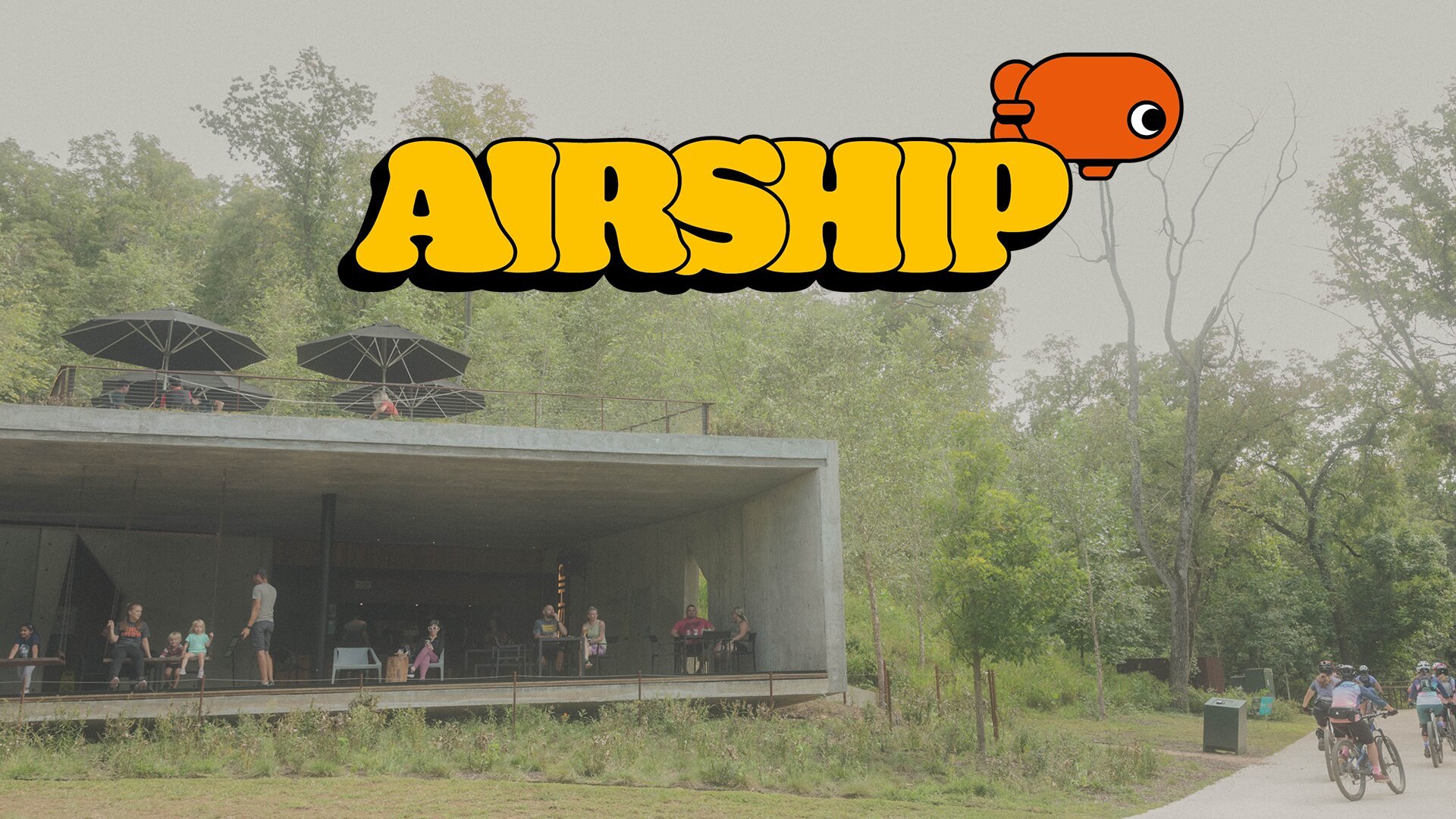 Community gathering at Airship Coffee with La Marzocco espresso equipment in modern outdoor pavilion