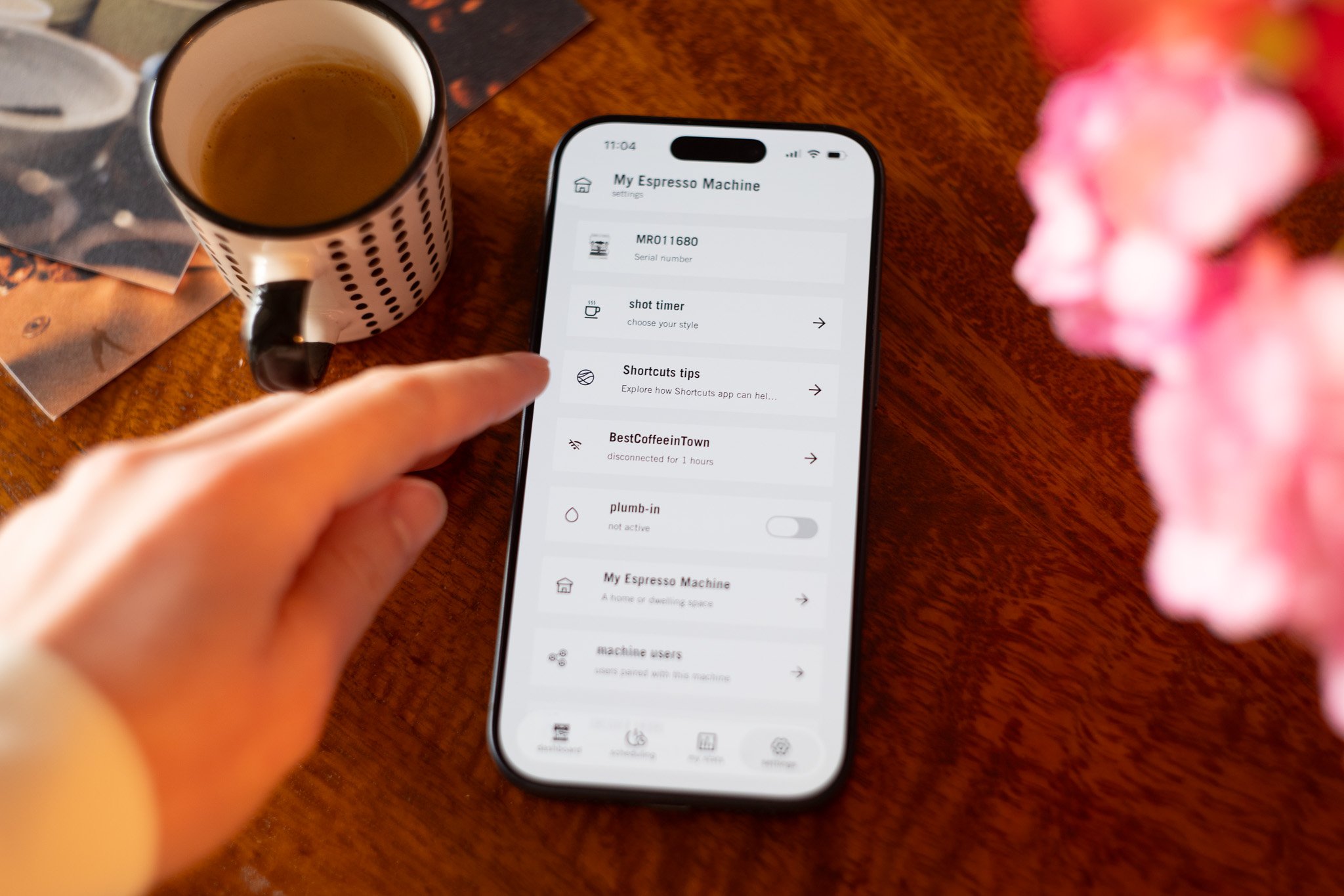 Espresso machine app interface displaying shot timer and machine settings on smartphone